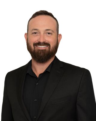 Portrait of Christoffer Calhoon, REALTOR®.